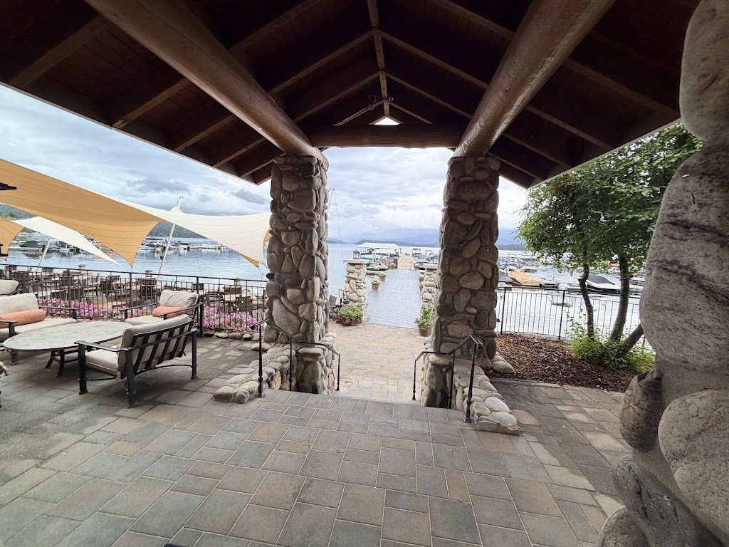 A covered stone patio looking out over the marina